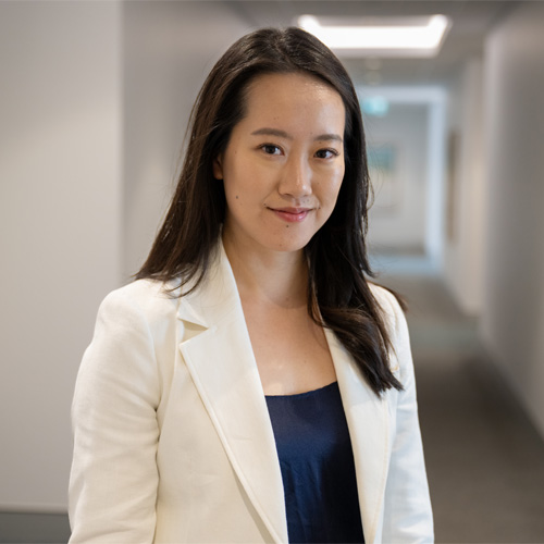 a woman in a white jacket